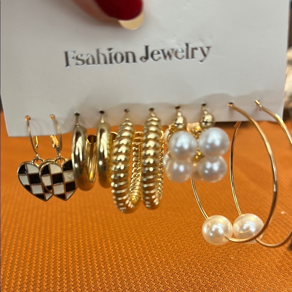 Gold and Black Earrings Set. Five pairs of costume jewelry earrings.